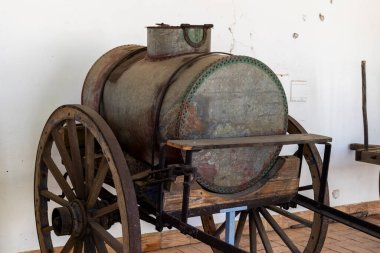 SAO BRAS DE ALPORTEL, PORTUGAL - 6th MAY 2024: Close view of several types of coaches and carriages in a well preserved exhibit. clipart