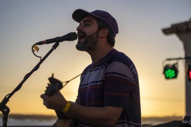 FARO, PORTUGAL: 6th SEPTEMBER, 2024 - Music artist, Romeu Bairos, performs on Festival F, a big festival on the city of Faro, Portugal. clipart