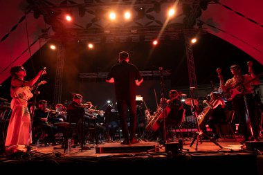 FARO, PORTUGAL: 6th SEPTEMBER, 2024 - Music artist, Capitao Fausto and Orquestra do Algarve, performs on Festival F, a big festival on the city of Faro, Portugal. clipart