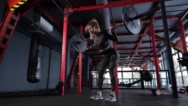 Athletic Girl Trains Muscles Lower Back Whis Barbell Gym Barbell — Stock Video