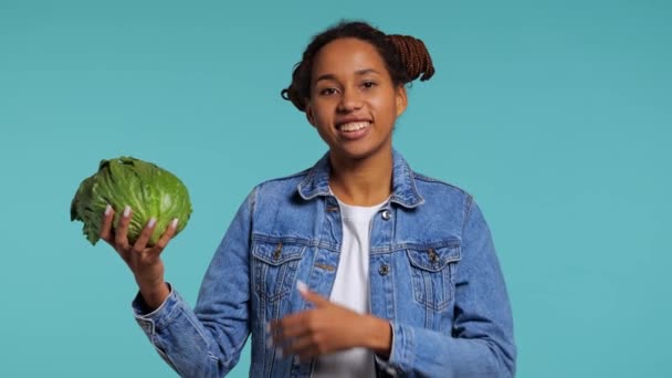 African Girl Holds Iceberg Lettuce Her Hands Smiles Studio Shot — Stock Video