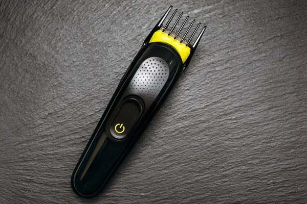 Razor Trimmer Cutting Hair Lies Black Rough Background Electric Razor — Stock Photo, Image