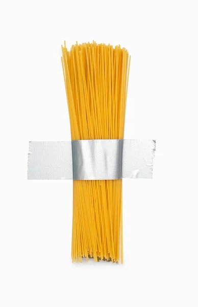 Los Espaguetis Crudos Largos Pegan Una Pared Blanca Con Cinta —  Fotos de Stock
