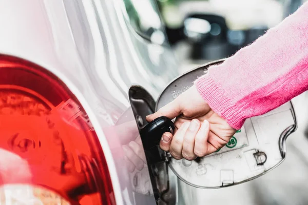 Closeup Female Hand Opening Car Fuel Tank Key — Stock Photo, Image