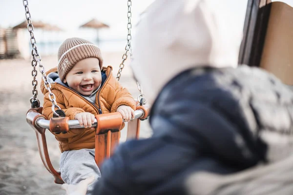 Mother Pushing Her Cheerful Infant Baby Boy Child Swing Sandy — Stock Photo, Image
