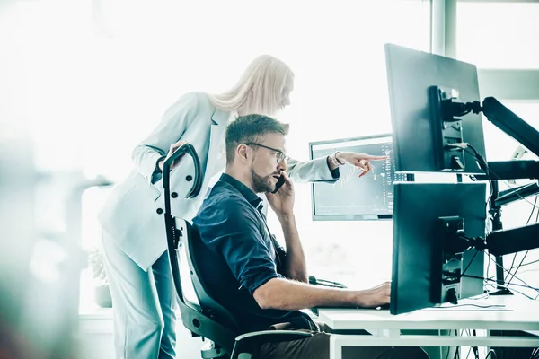 Two Thoughtful Business Colleagues Looking Data Multiple Computer Screens Solving — Stock Photo, Image