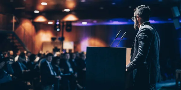 stock image Speaker giving a talk on corporate business conference. Unrecognizable people in audience at conference hall. Business and Entrepreneurship event.