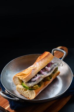 Food Concept herring sandwich on black background with copy space