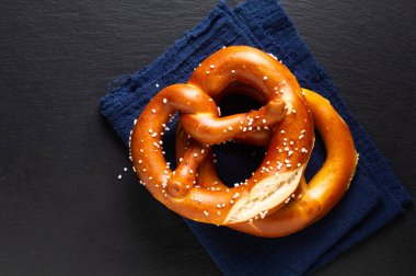 Food concept Homemade Soft Pretzels on black background with copy space