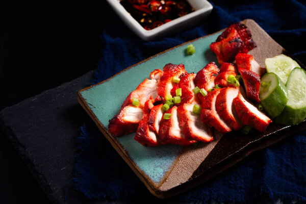 Asian food concept Char siu  Cantonese-style barbecued pork on black background with copy space