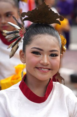 Tarakan - Indonesia, 7 October 2023 : young girl wearing traditional clothing from the indigenous Tidung tribe during the cultural parade clipart