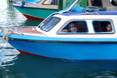 Tarakan - Indonesia, 22 December 2022 : Passenger speedboats are preparing to depart on inter-district routes in North Kalimantan clipart