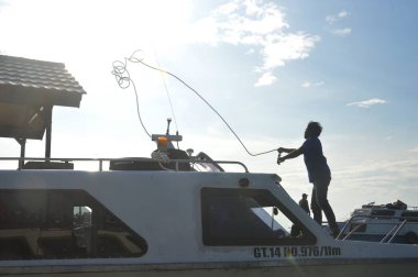 Tarakan - Indonesia, 3 November 2018 : Passenger speedboats are preparing to depart on inter-district routes in North Kalimantan clipart