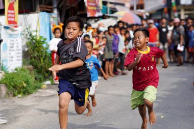 TARAKAN - INDONESIA. 17 August 2023 : running race in celebration of Indonesia's independence day clipart