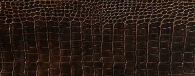 Çok lüks kahverengi timsah derisi. Tekstil endüstrisinde kullanılır. Orijinal deri.