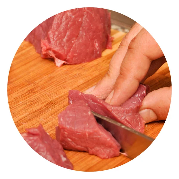 Clean very fresh red raw cow meat sharp knife and hand, on cutting board