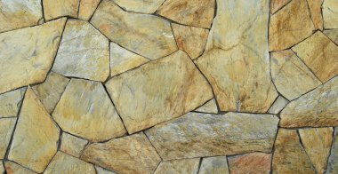 Sağlam sarı ve bej kesimli taş duvar, arka planlar için iyi, düzgün sıralanmış.