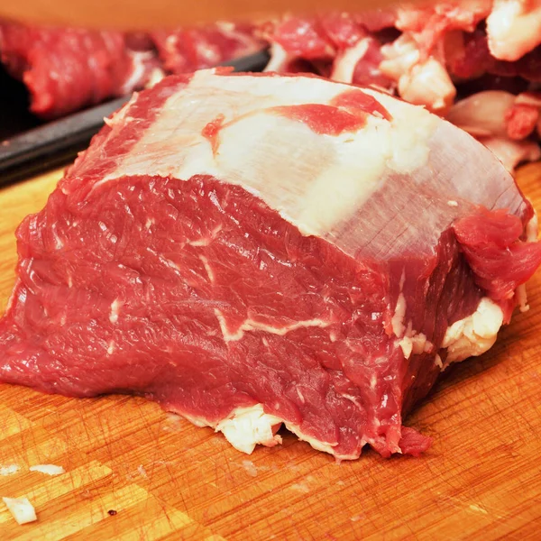 Clean very fresh red raw cow meat beef, bamboo on cutting board