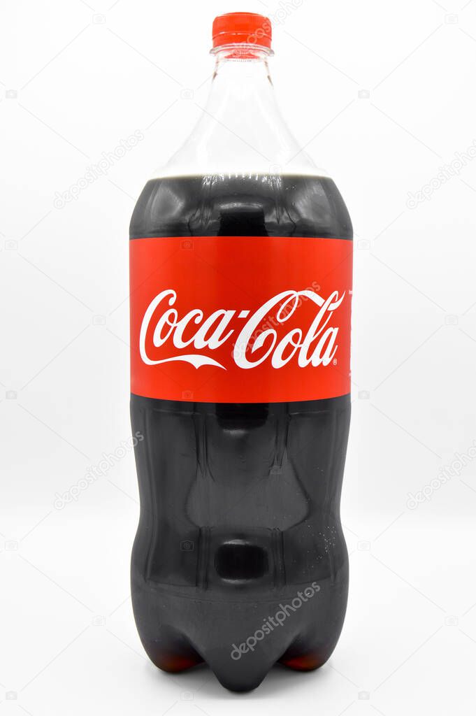 World famous carbonated drink Coca Cola sold in healthy plastic pet bottles, isolated on white background, Turkey Istanbul March 09 2019
