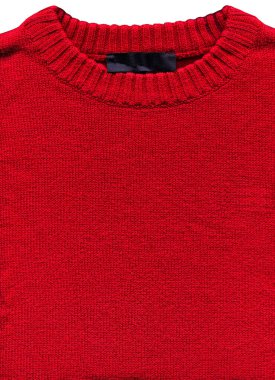 Örülmüş kırmızı yün örgü örülmüş süveter, arka plan dokusu, yün ve siyah süveter etiketi desenli kumaş.