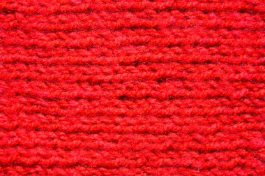 Yünden desenli kumaş. El yapımı kumaş, kırmızı yün arkaplan dokusu