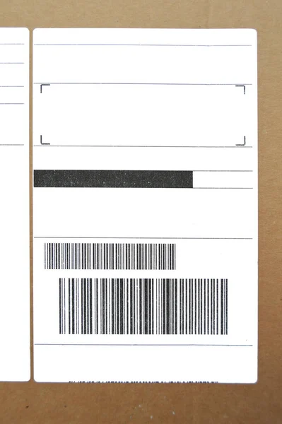 Brown and beige cardboard paper mail envelope on sticky barcodes. Can be used in company correspondence