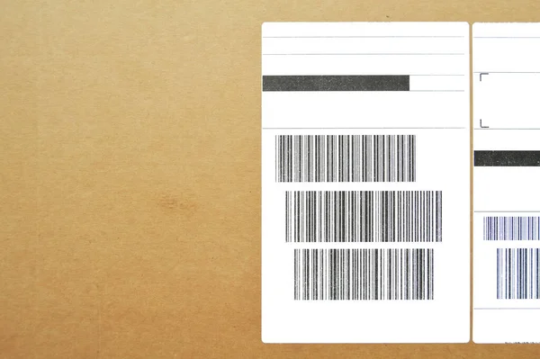 Brown and beige cardboard paper mail envelope on sticky barcodes. Can be used in company correspondence
