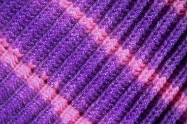 Yünden desenli kumaş. El yapımı kumaş mor ve pembe yün arkaplan dokusu