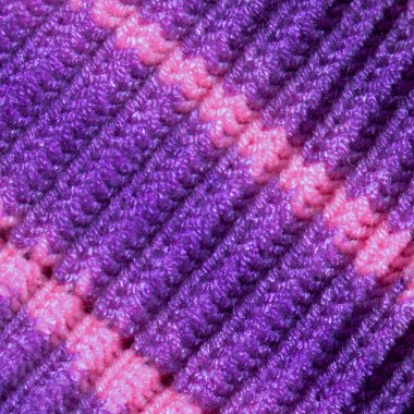 Yünden desenli kumaş. El yapımı kumaş mor ve pembe yün arkaplan dokusu