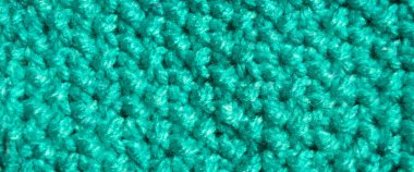 Pattern fabric made of wool. Handmade knitted fabric blue and turquoise wool background texture