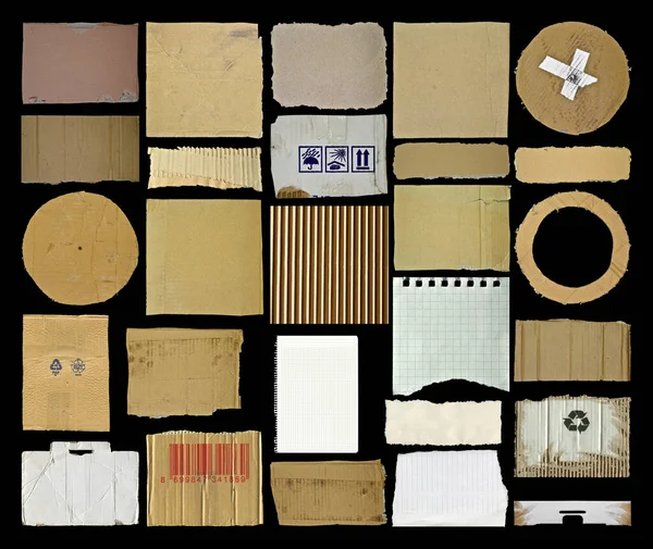 Brown beige and white corrugated cardboard paper pieces, isolated on black background