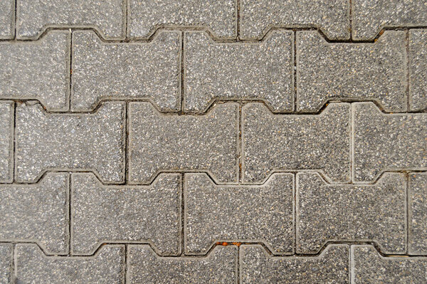 Cobblestone formed from the confluence of tiny pebbles. Seamless, tile