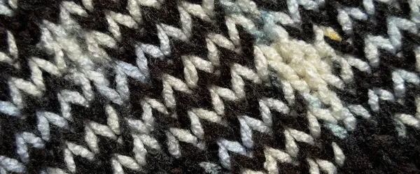 Yünden desenli kumaş. El yapımı örgü kumaş beyaz kahverengi yün arkaplan dokusu
