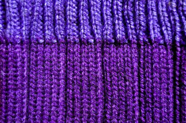 Yünden desenli kumaş. El yapımı kumaş mor yün arkaplan dokusu