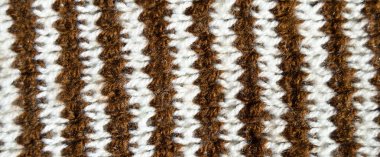 Yünden desenli kumaş. El yapımı kahverengi ve beyaz yün arkaplan dokusu