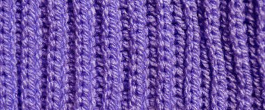 Yünden desenli kumaş. El yapımı kumaş mor ve mavi yün arkaplan dokusu