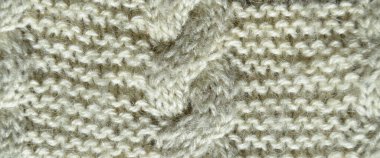 Yünden desenli kumaş. El yapımı örgü kumaş gri ve beyaz yün arkaplan dokusu