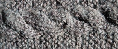 Yünden desenli kumaş. El yapımı örgü kumaş gri yün arkaplan dokusu