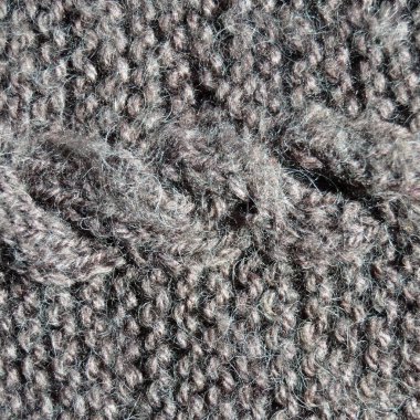 Yünden desenli kumaş. El yapımı örgü kumaş gri yün arkaplan dokusu