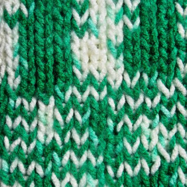 Yünden desenli kumaş. El yapımı kumaş yeşil ve beyaz yün arkaplan dokusu