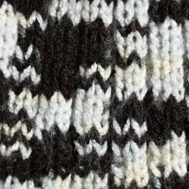 Yünden desenli kumaş. El yapımı kumaş ve siyah kahverengi yün arkaplan dokusu