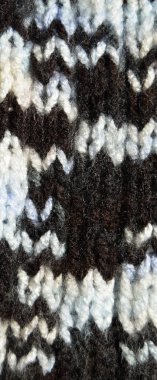 Yünden desenli kumaş. El yapımı kumaş ve siyah kahverengi yün arkaplan dokusu