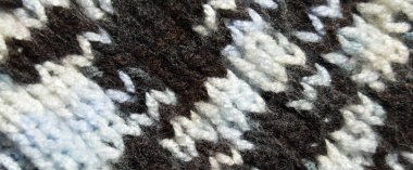 Yünden desenli kumaş. El yapımı kumaş ve siyah kahverengi yün arkaplan dokusu