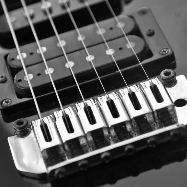 stock image Electric guitar bridge, strings and pickup. Detail close-up view of guitar pickup in blue color. Music instrument