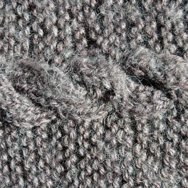 Yünden desenli kumaş. El yapımı örgü kumaş gri yün arkaplan dokusu
