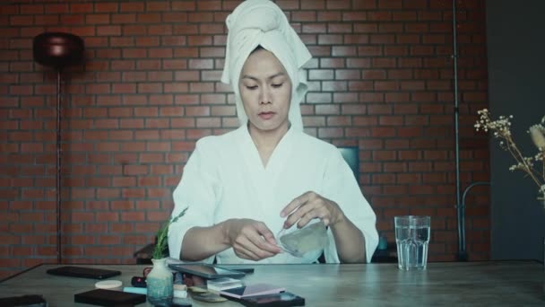 Young Asian Transgender Queer Man Does His Makeup His Room — Vídeos de Stock