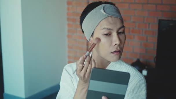 Young Asian Transgender Queer Man Does His Makeup His Room — Stok video