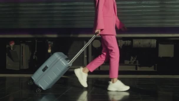 Young Woman Pink Suit Suitcase Walking Platform Train Slow Motion — Video Stock