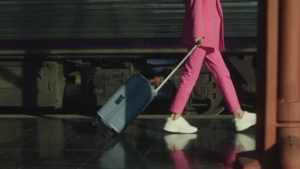 Young Woman Pink Suit Suitcase Walking Platform Train Slow Motion — Stock Video