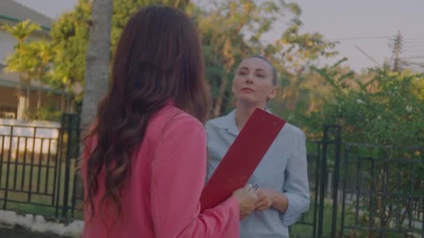 Young Female Real Estate Agent Pink Business Suit Documents Hand — Stock Video